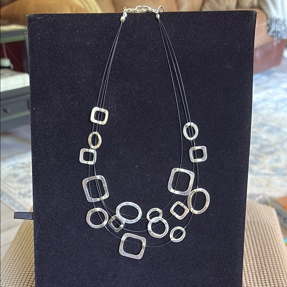 Silver Pendant Necklace with Intricate Detailing